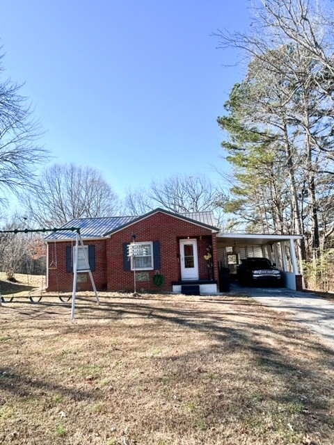 203 Glenhaven Road Paris, TN 38242 - Photo 41 of 42 a front view of a house with a yard