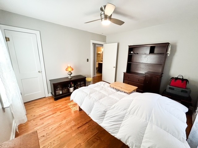 203 Glenhaven Road Paris, TN 38242 - Photo 8 of 42 a bedroom with a bed and a chandelier