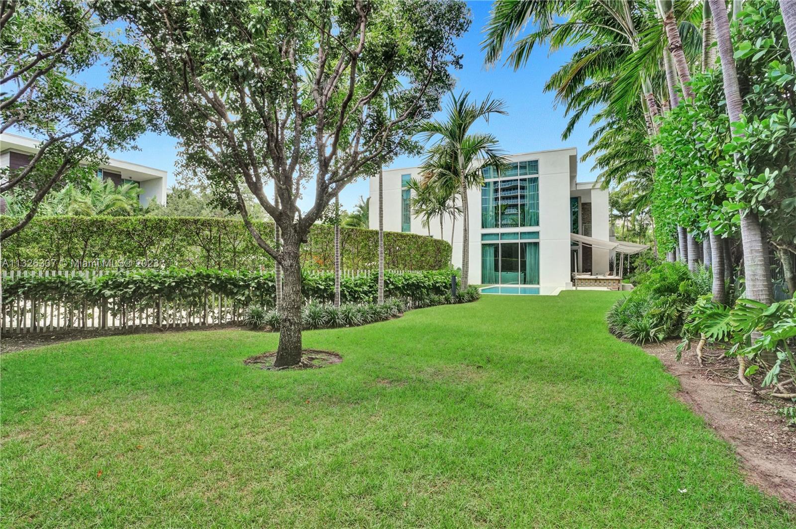 112 Reef Lane Key Biscayne, FL 33149 - Photo 31 of 41 a house in middle of a garden