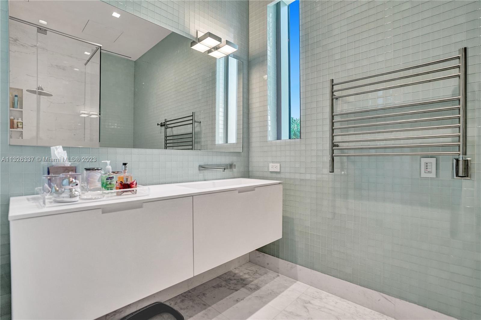 112 Reef Lane Key Biscayne, FL 33149 - Photo 8 of 41 a bathroom with a sink and a mirror