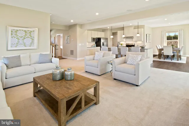 a living room with furniture and a table
