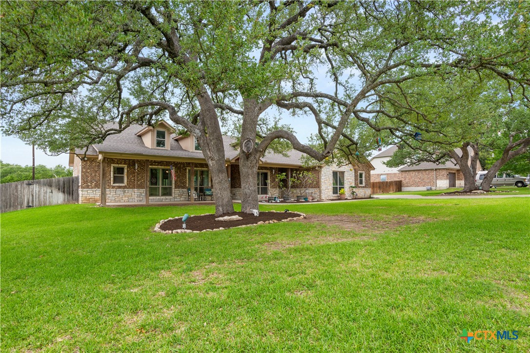 2649 Bowles Ranch Road Belton, TX 76513 - Photo 3 of 36 a front view of a house with yard and green space