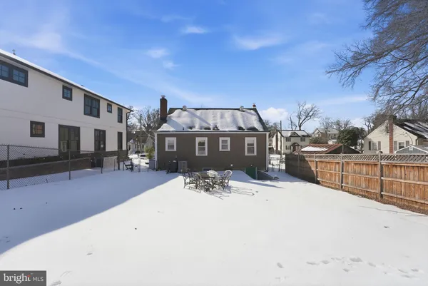 a view of a house with a snow in the yard