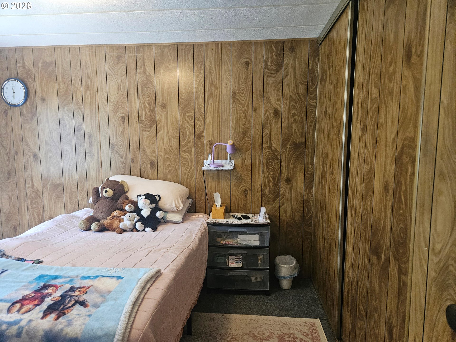 1600 Rhododendron Drive, Unit 214 Florence, OR 97439 - Photo 18 of 38 a bedroom with a bed and a window