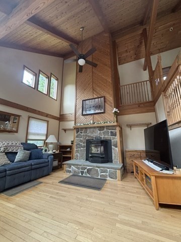200 Peru Road Windsor, MA 01270 - Photo 14 of 42 a living room with furniture a flat screen tv and a fireplace