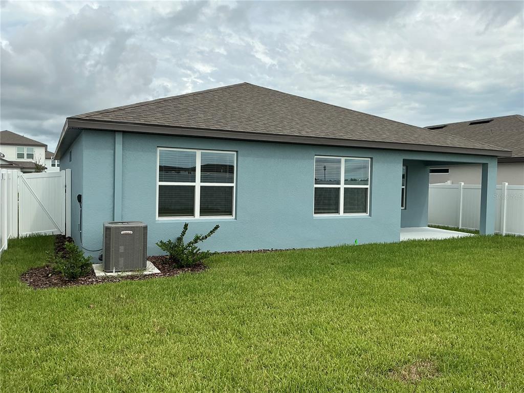 4022 Obsidian Drive Spring Hill, FL 34609 - Photo 3 of 4 a front view of a house with garden