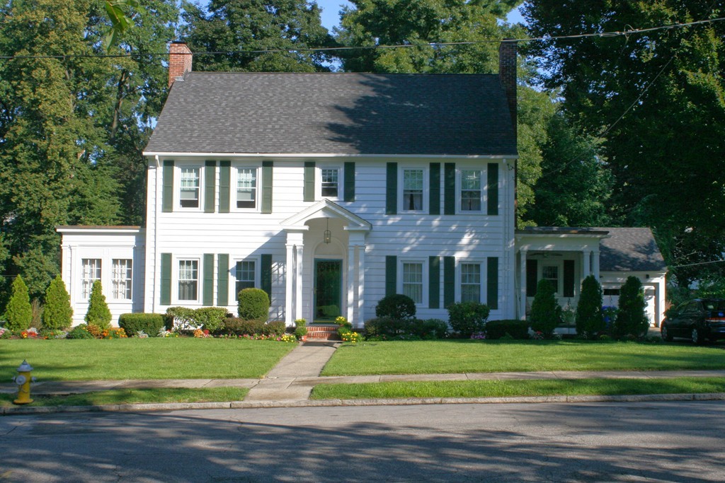 104 Shefford Street Springfield, MA 01107 - Photo 1 of 18 a front view of a house with a yard