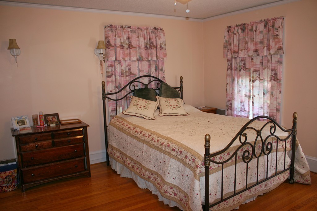 104 Shefford Street Springfield, MA 01107 - Photo 12 of 18 a bedroom with a bed and a dresser