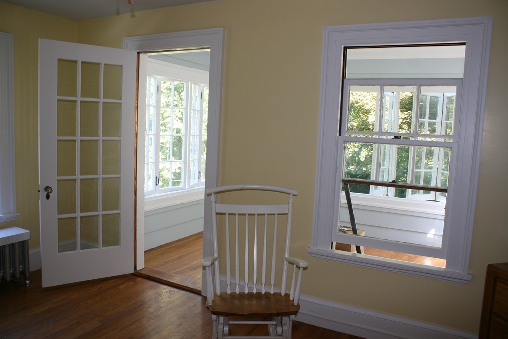 104 Shefford Street Springfield, MA 01107 - Photo 15 of 18 a view of a room with wooden floor and a window