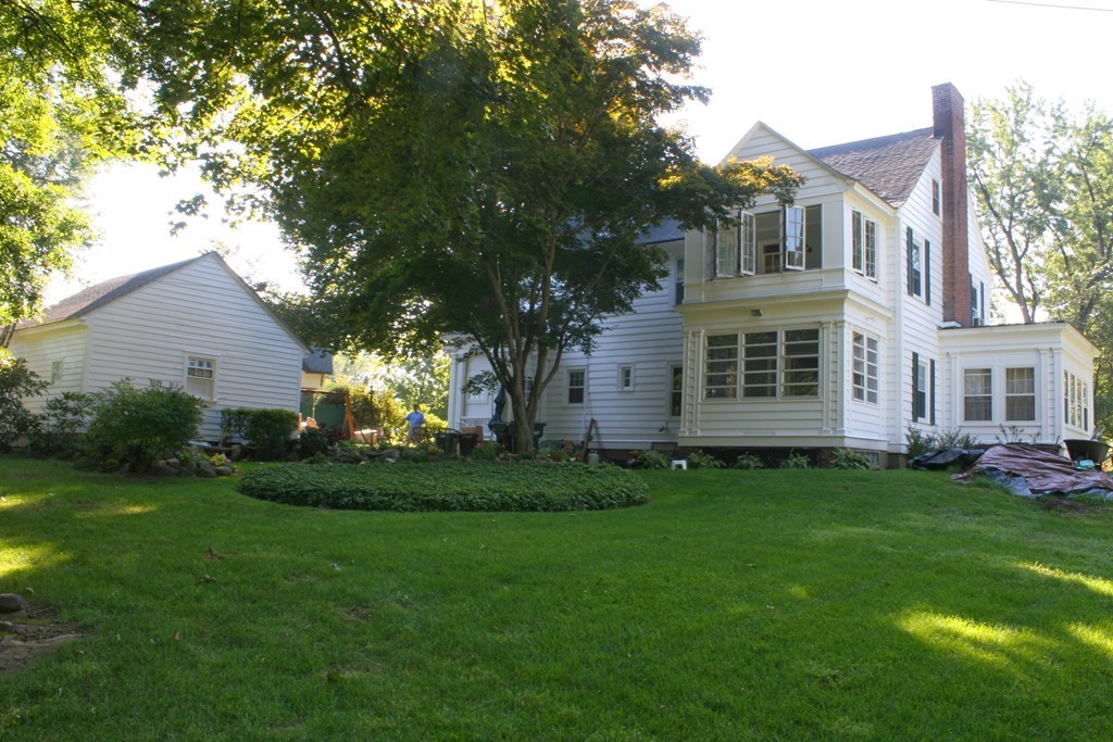 104 Shefford Street Springfield, MA 01107 - Photo 4 of 18 a front view of a house with a garden