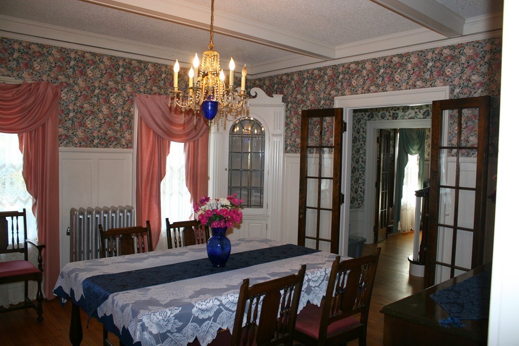 104 Shefford Street Springfield, MA 01107 - Photo 7 of 18 a view of a dining room with furniture and chandelier