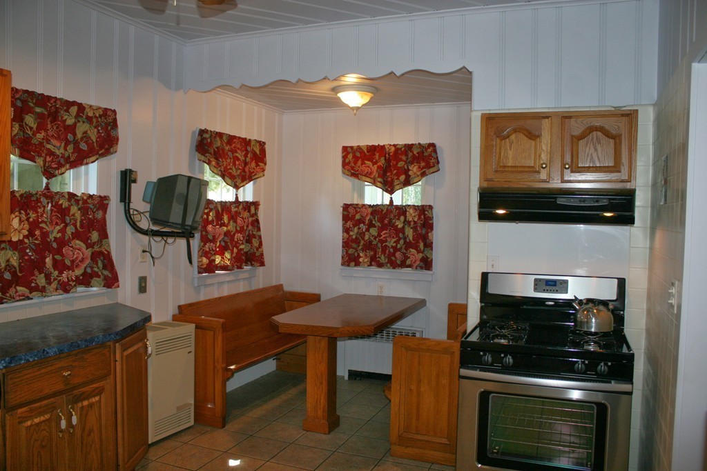 104 Shefford Street Springfield, MA 01107 - Photo 10 of 18 a kitchen with stainless steel appliances a stove and a microwave