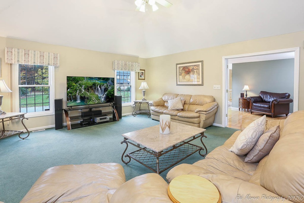 9 Garrison Road Dracut, MA 01826 - Photo 18 of 30 a living room with furniture and a flat screen tv