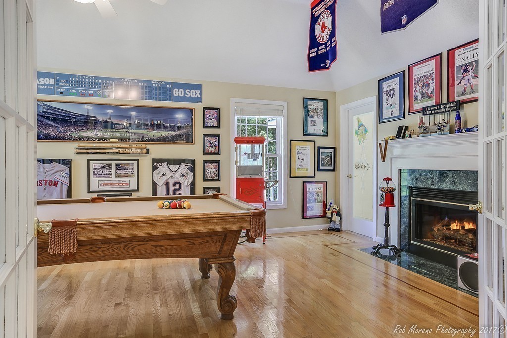 9 Garrison Road Dracut, MA 01826 - Photo 23 of 30 a living room with furniture and a fireplace