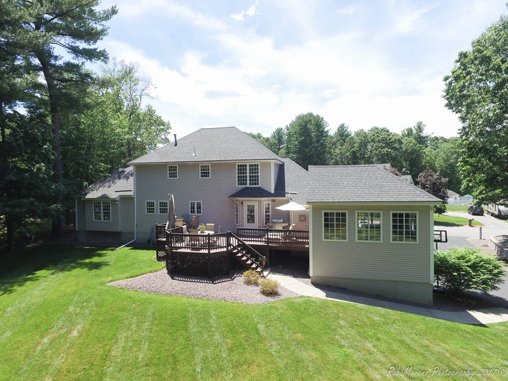 9 Garrison Road Dracut, MA 01826 - Photo 4 of 30 a view of a house with a big yard plants and large trees