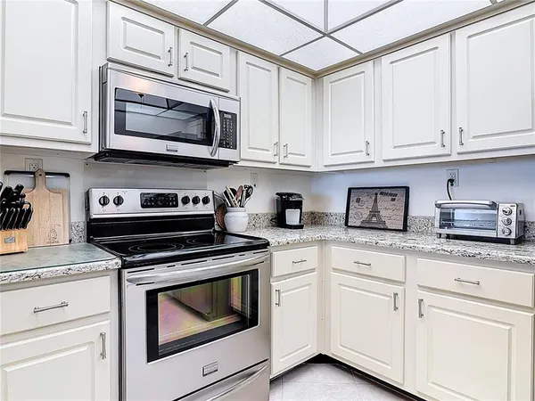a kitchen with a stove and a microwave