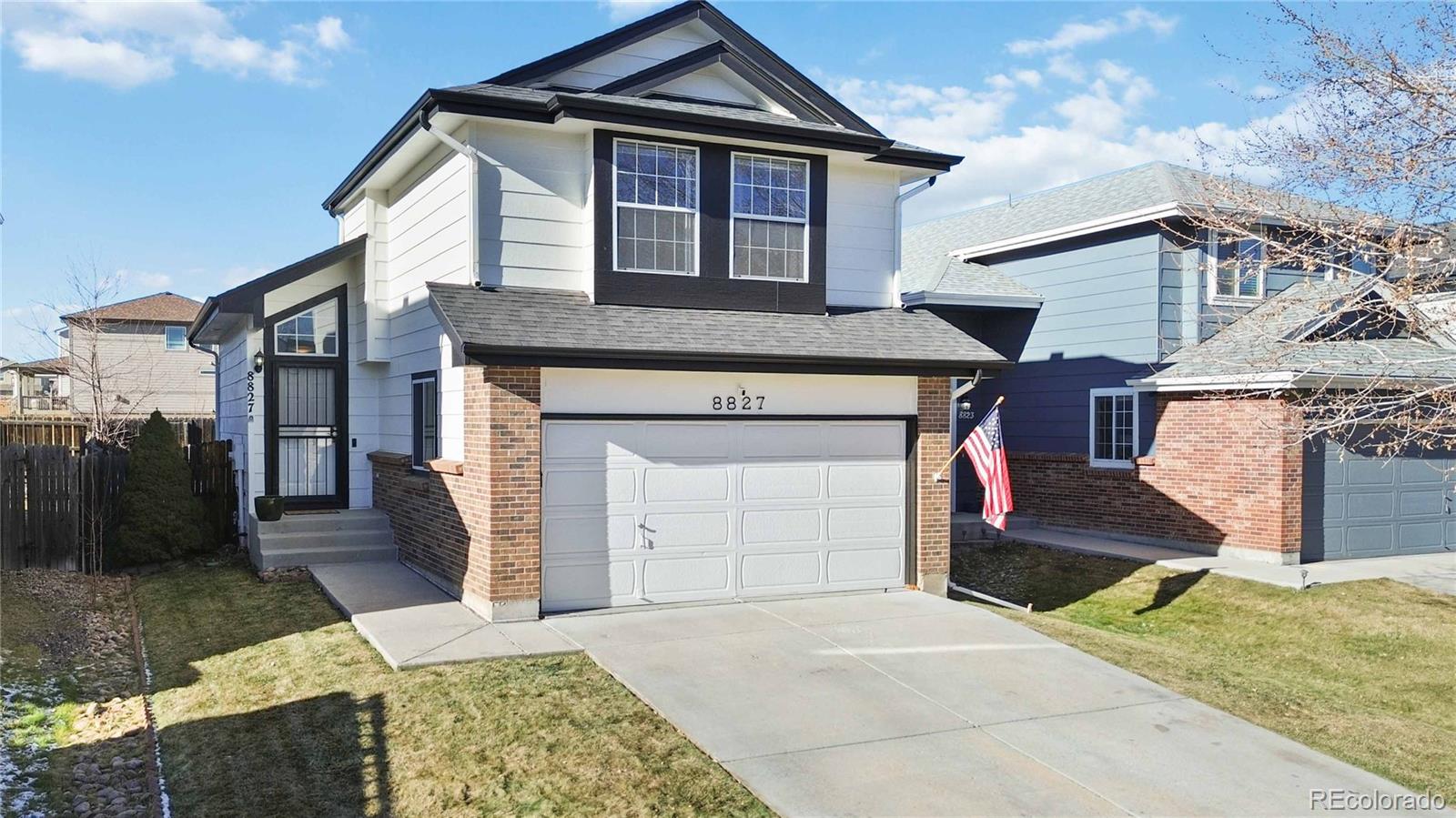 a front view of a house with a garage