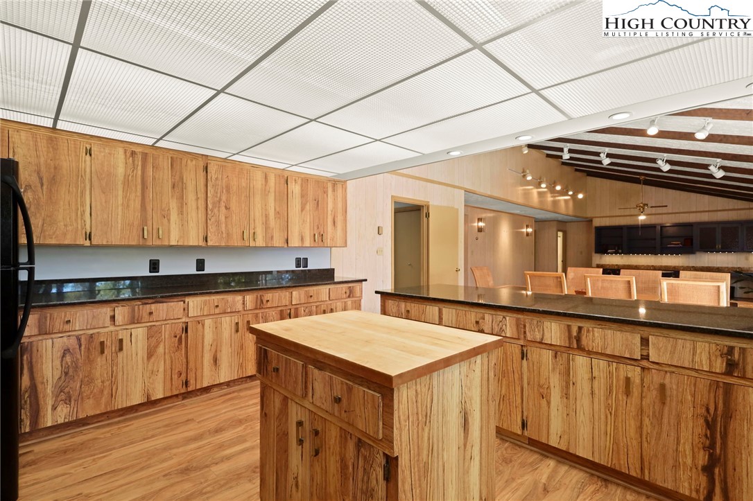 202 Cliffside Lane Seven Devils, NC 28604 - Photo 12 of 46 a kitchen that has a sink and a stove in it