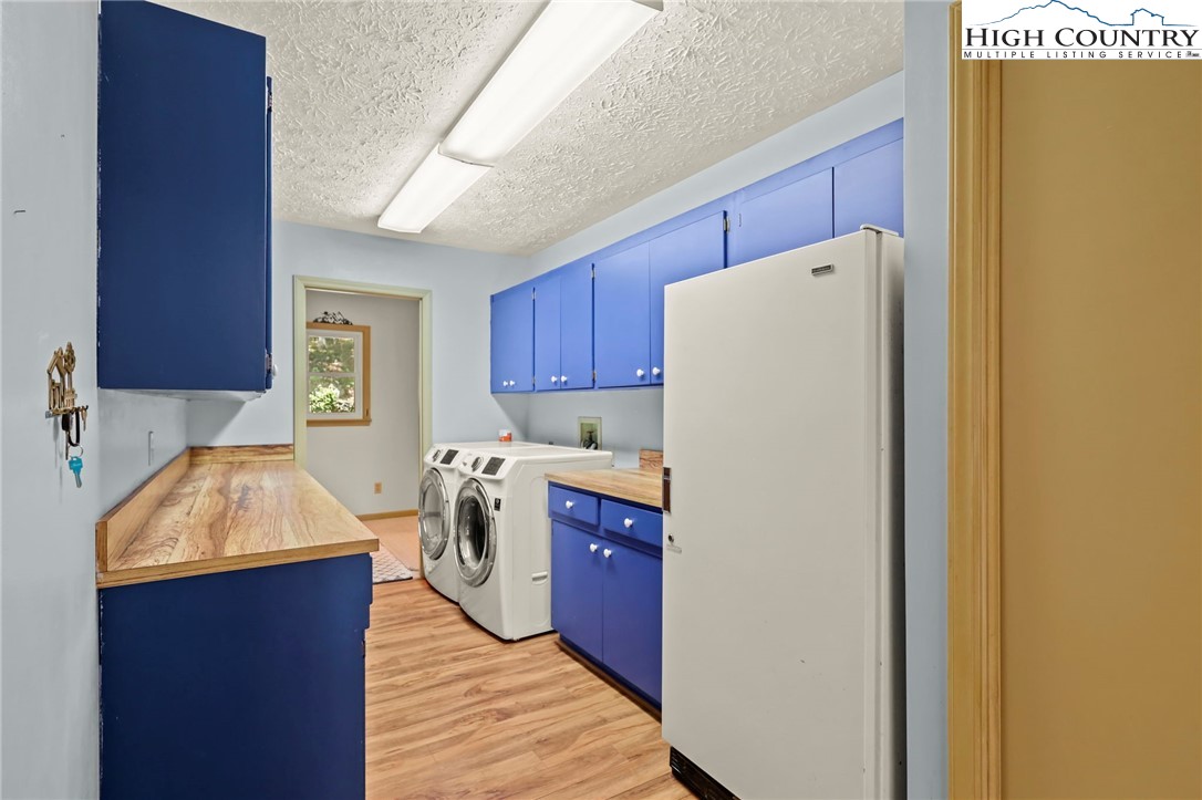 202 Cliffside Lane Seven Devils, NC 28604 - Photo 16 of 46 a kitchen with a refrigerator sink and cabinets
