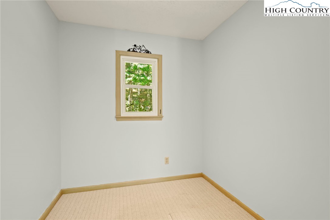 202 Cliffside Lane Seven Devils, NC 28604 - Photo 18 of 46 an empty room with a window