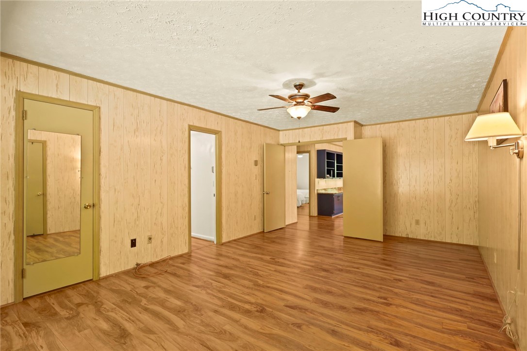 202 Cliffside Lane Seven Devils, NC 28604 - Photo 19 of 46 a view of an empty room with wooden floor