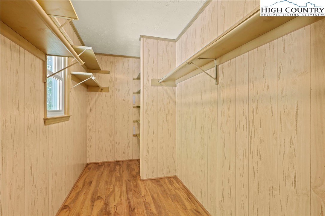 202 Cliffside Lane Seven Devils, NC 28604 - Photo 24 of 46 a view of a room with wooden floor and door