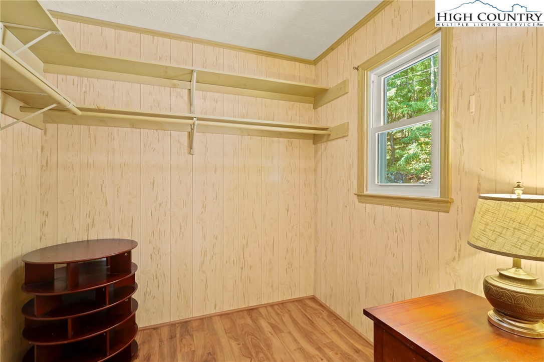 202 Cliffside Lane Seven Devils, NC 28604 - Photo 25 of 46 a view of a room with wooden floor and windows