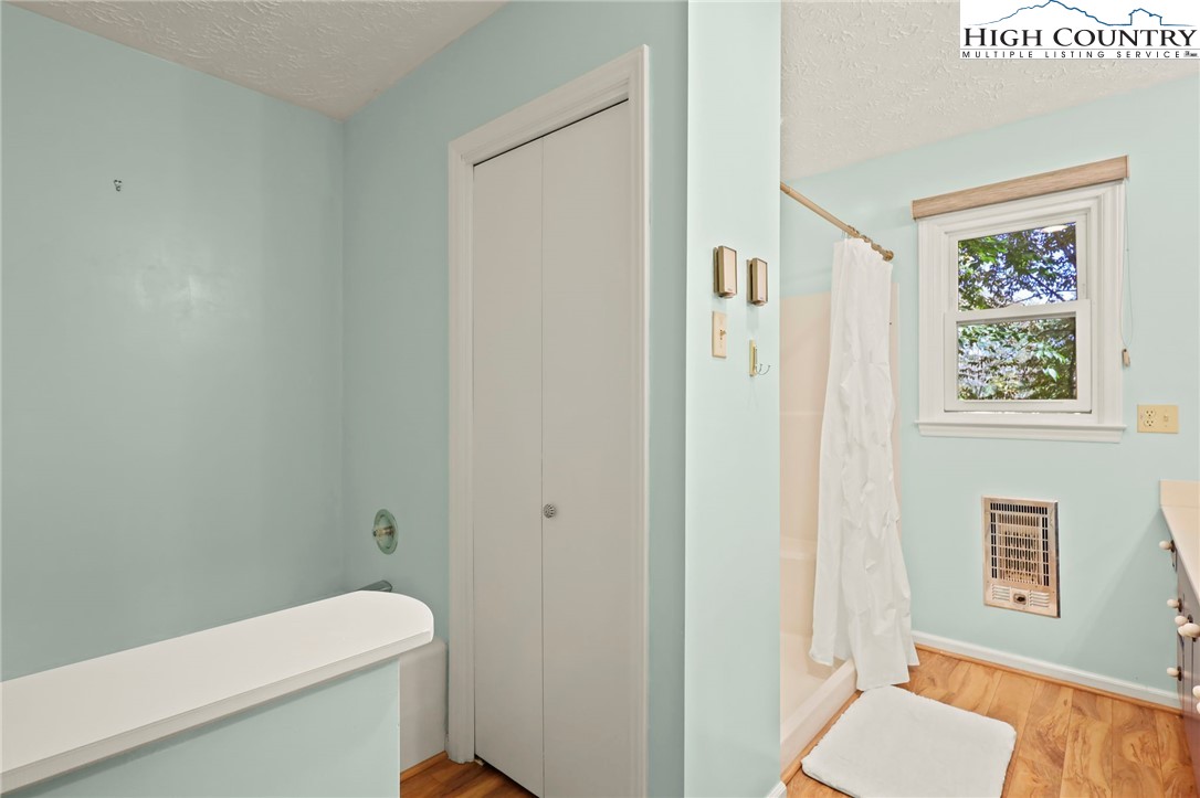 202 Cliffside Lane Seven Devils, NC 28604 - Photo 29 of 46 a white toilet sitting next to a bathroom sink