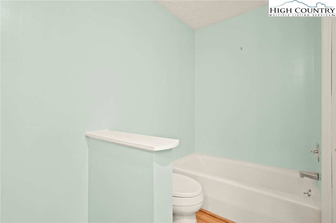 202 Cliffside Lane Seven Devils, NC 28604 - Photo 31 of 46 a bath room with a toilet