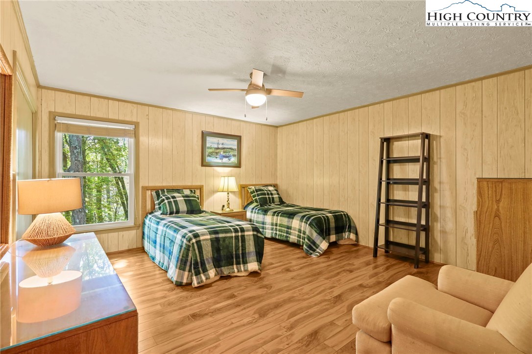 202 Cliffside Lane Seven Devils, NC 28604 - Photo 32 of 46 a living room with furniture and a wooden floor