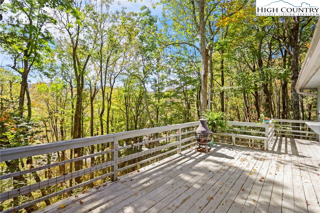 202 Cliffside Lane Seven Devils, NC 28604 - Photo 42 of 46 a view of wooden balcony with outdoor space