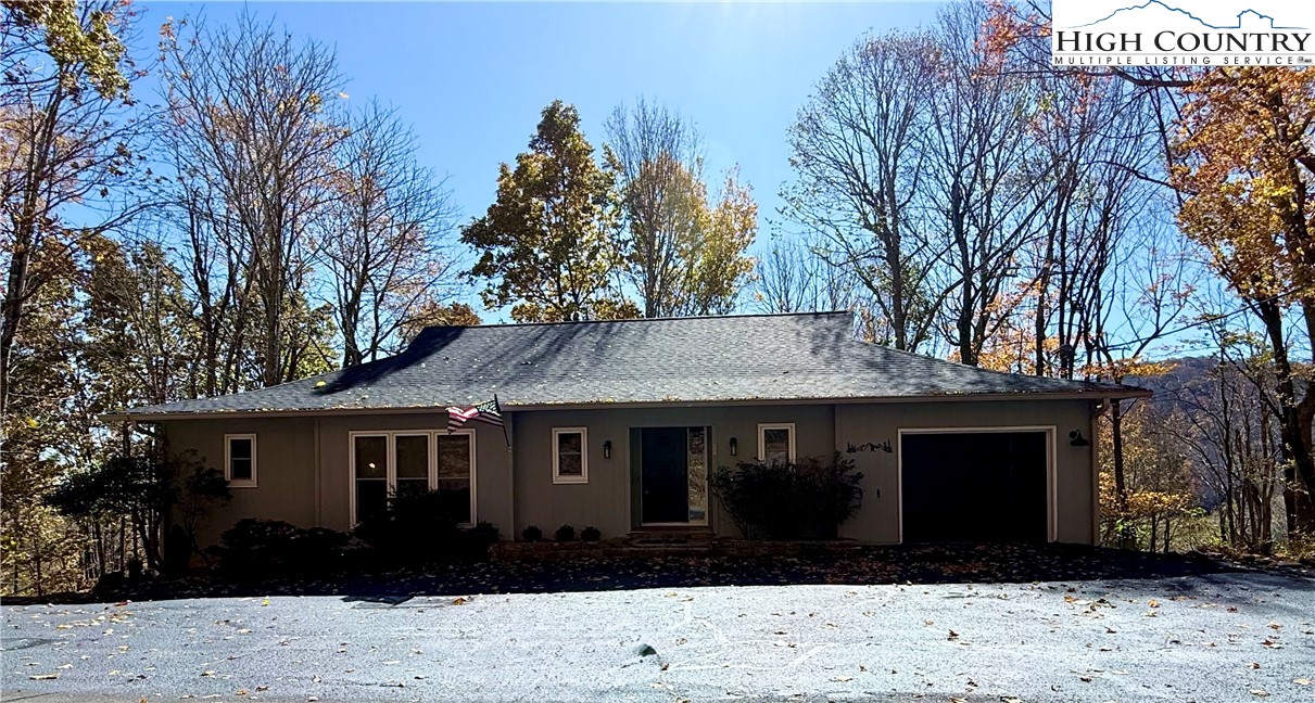 202 Cliffside Lane Seven Devils, NC 28604 - Photo 46 of 46 a front view of a house with a garden