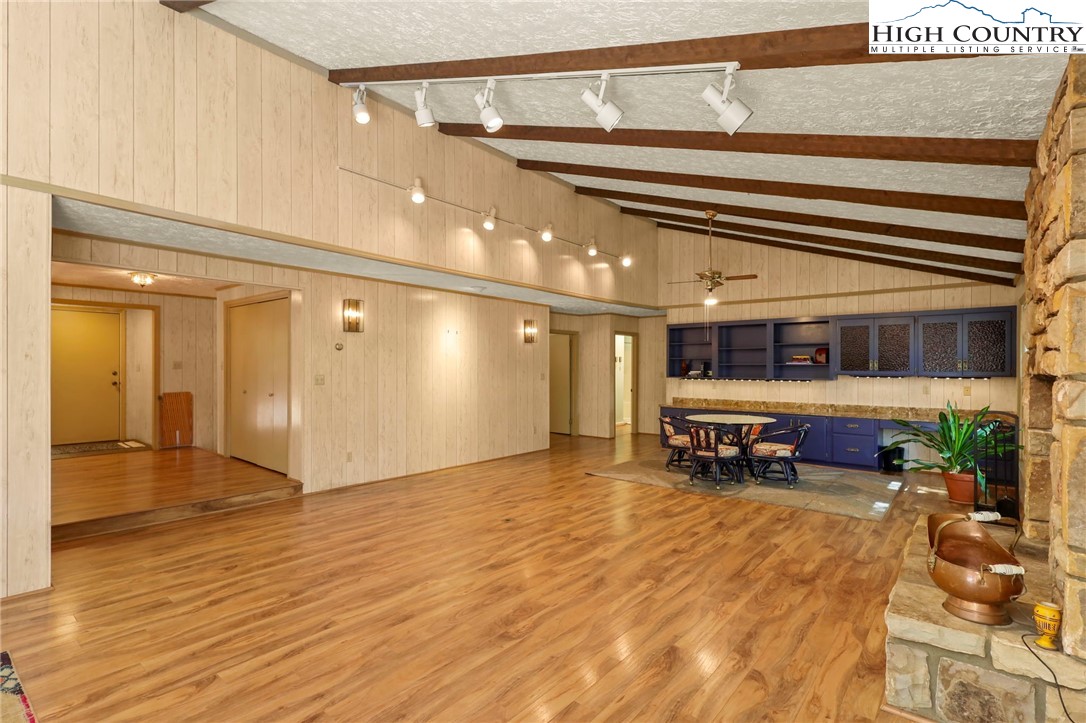 202 Cliffside Lane Seven Devils, NC 28604 - Photo 5 of 46 a view of a room with wooden floor and furniture