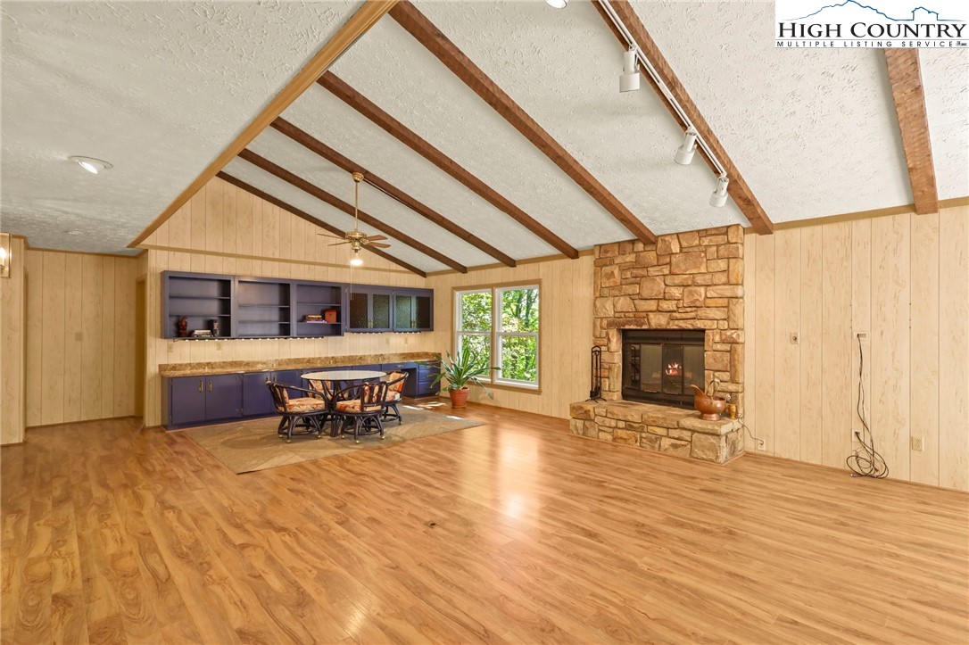202 Cliffside Lane Seven Devils, NC 28604 - Photo 6 of 46 a view of livingroom with furniture fire place and wooden floor