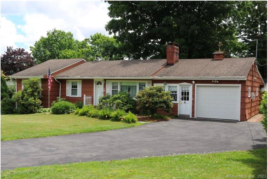 a aerial view of a house with a yard and plants