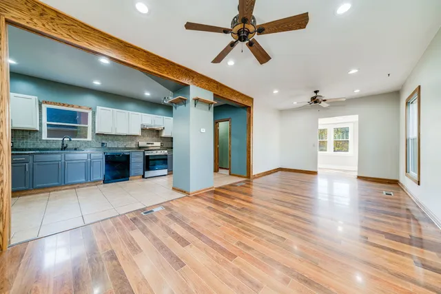 a view of a kitchen with a sink and a stove top oven
