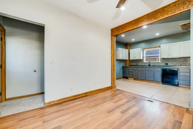 a view of kitchen with wooden floor