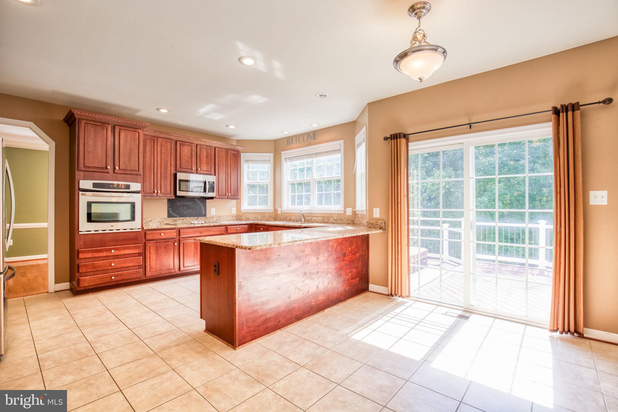 68 MacGregor Ridge Road Stafford, VA 22554 - Photo 13 of 42 Table Area & Counter has overhang for more seating