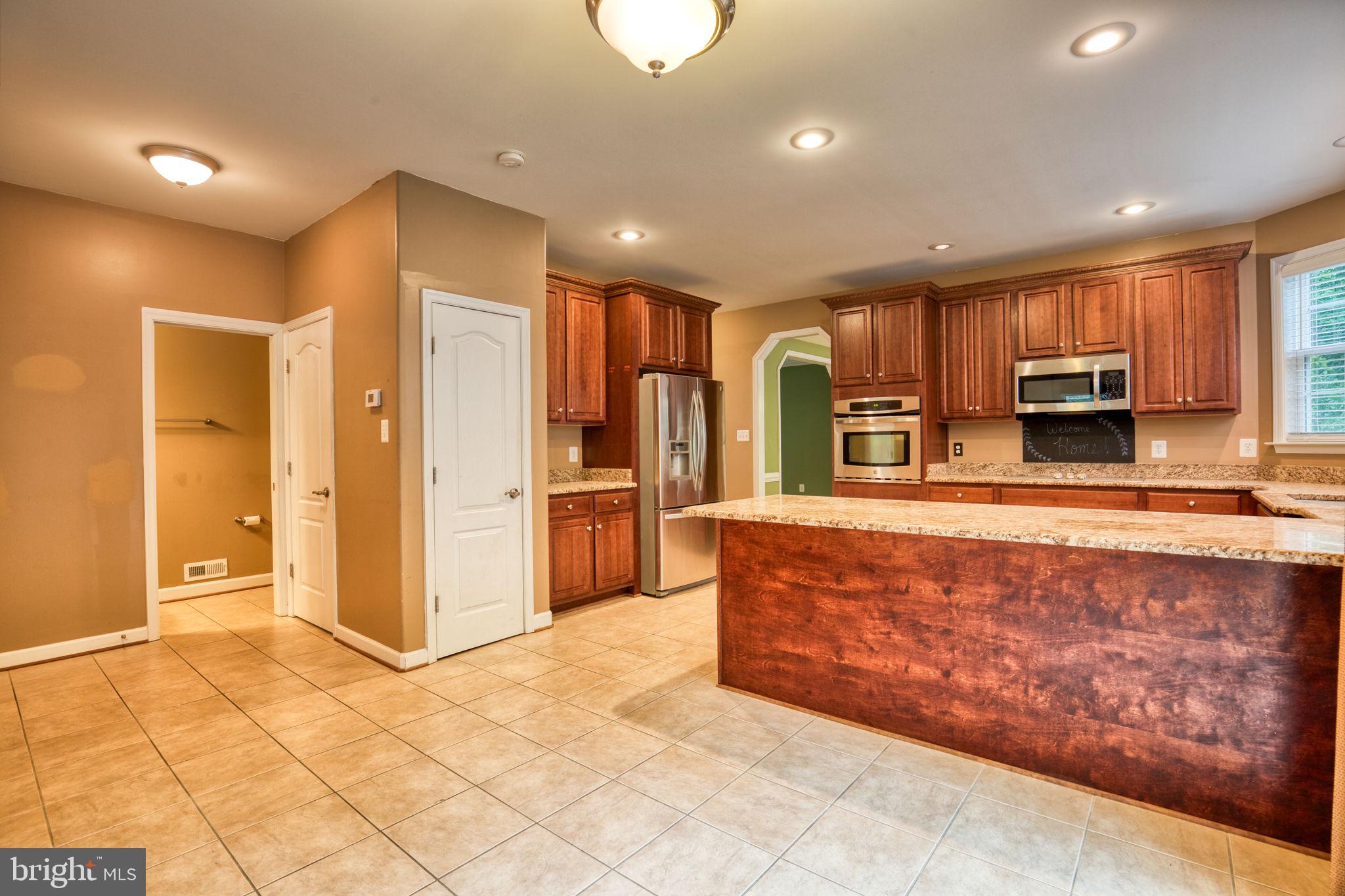 68 MacGregor Ridge Road Stafford, VA 22554 - Photo 14 of 42 Plenty of room for table, chairs, & bar stools.