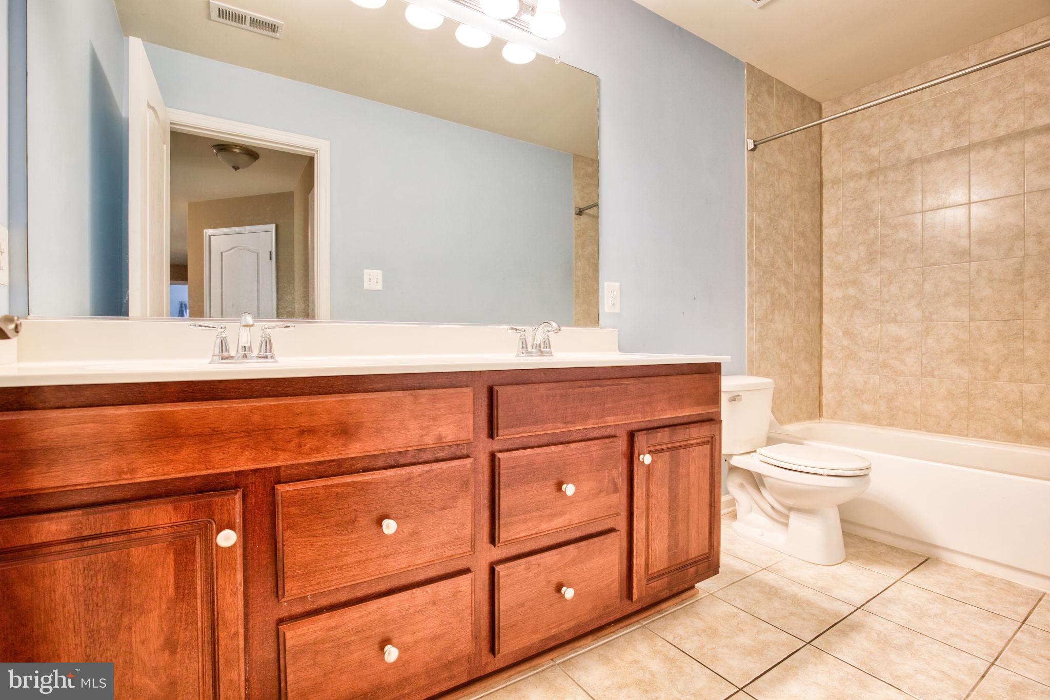 68 MacGregor Ridge Road Stafford, VA 22554 - Photo 25 of 42 Hall Bath with Double Vanities and Tile Flooring
