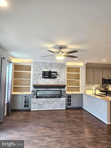 a view of a kitchen with a sink and a refrigerator
