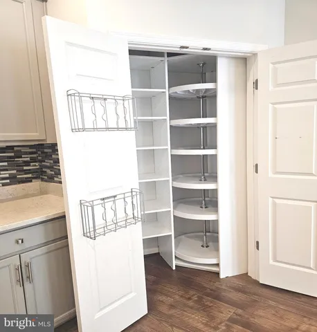 a living room with furniture a window and a table