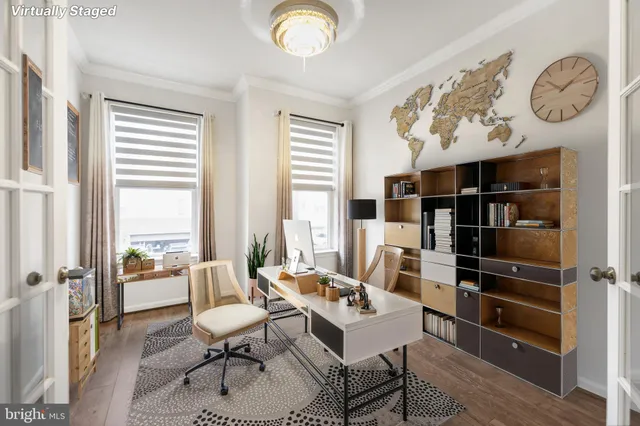 a dining room with furniture a chandelier and wooden floor