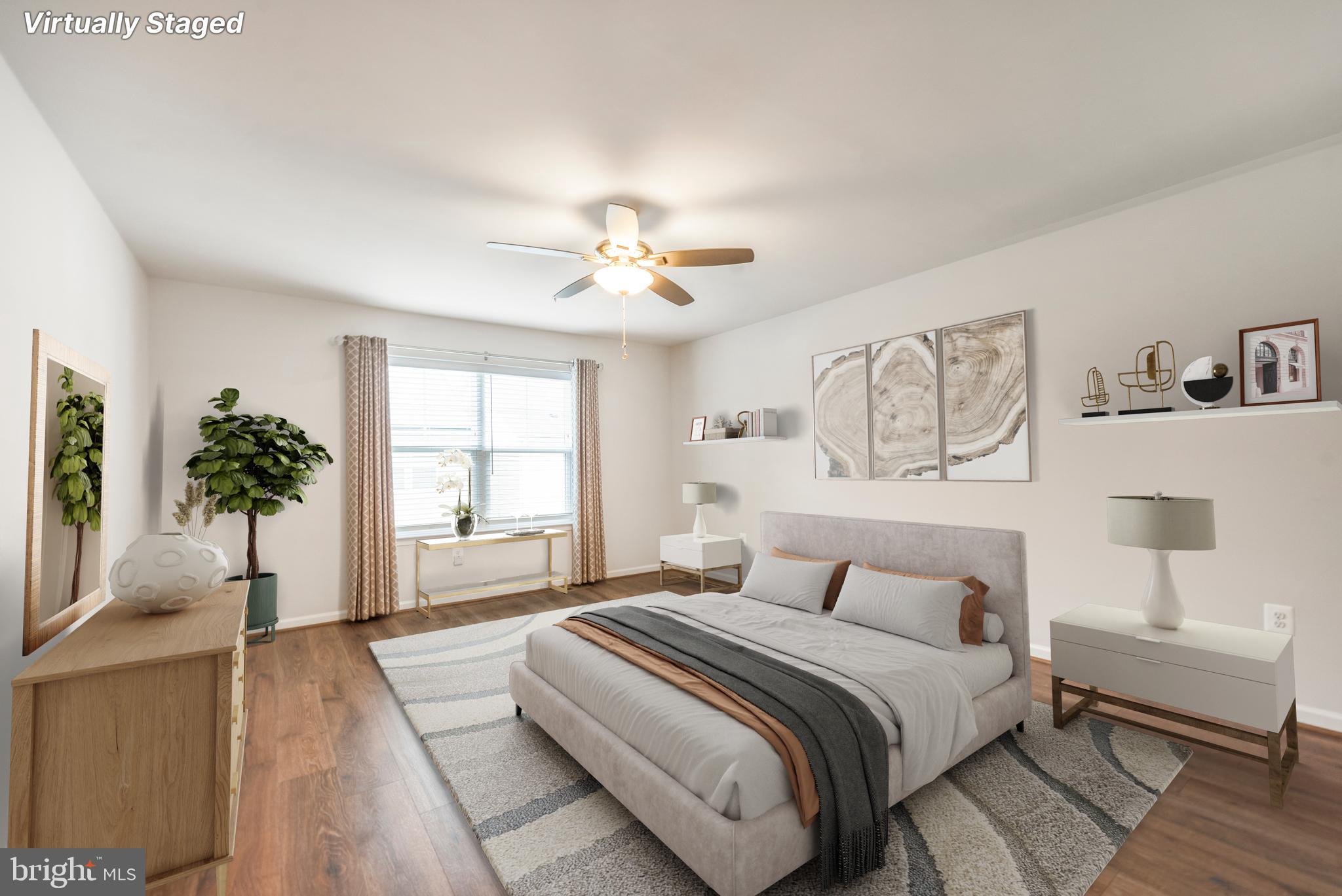3510 Landing Way Silver Spring, MD 20906 - Photo 25 of 47 a spacious bedroom with a large bed and a chandelier