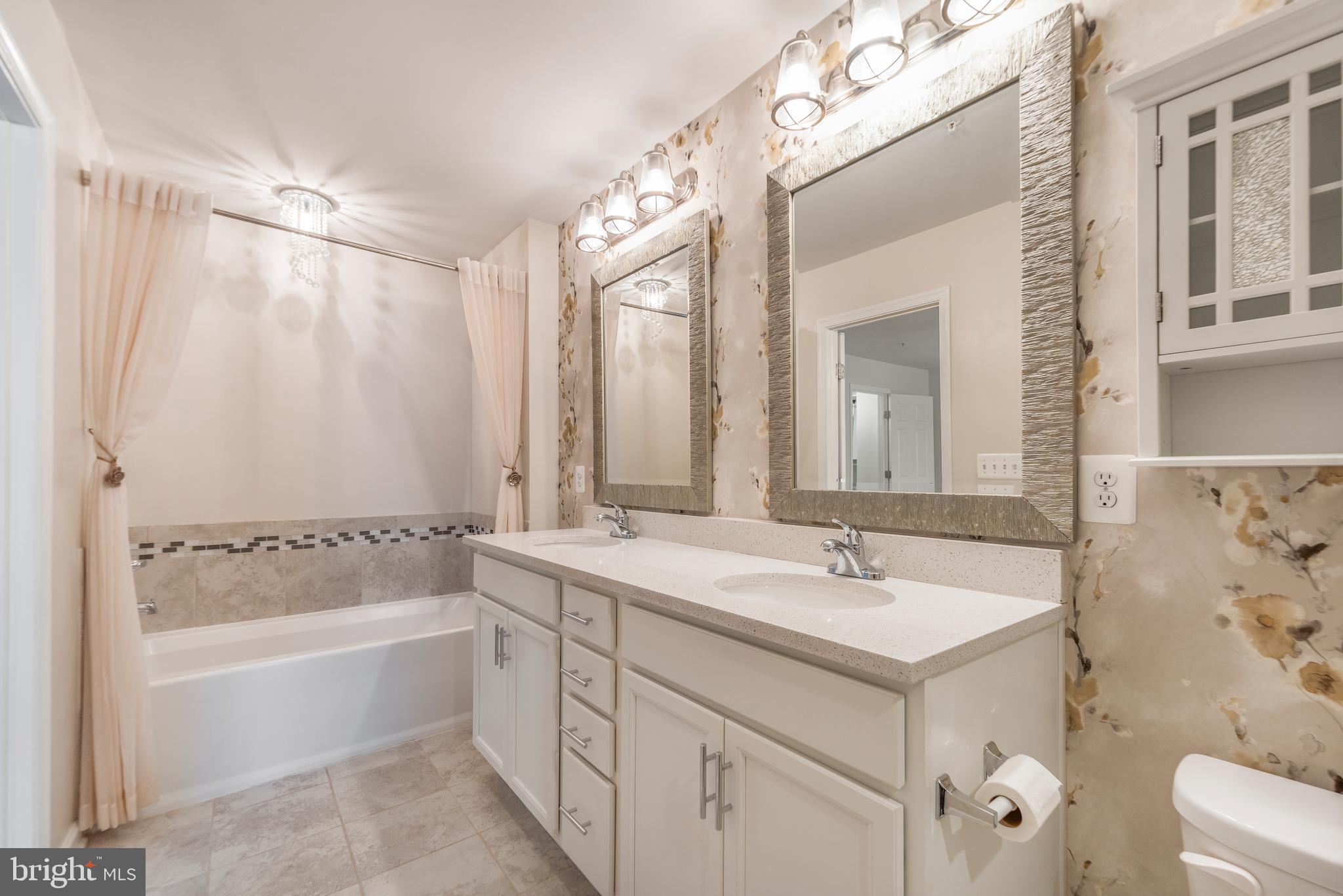 3510 Landing Way Silver Spring, MD 20906 - Photo 30 of 47 a bathroom with a tub sink and mirror