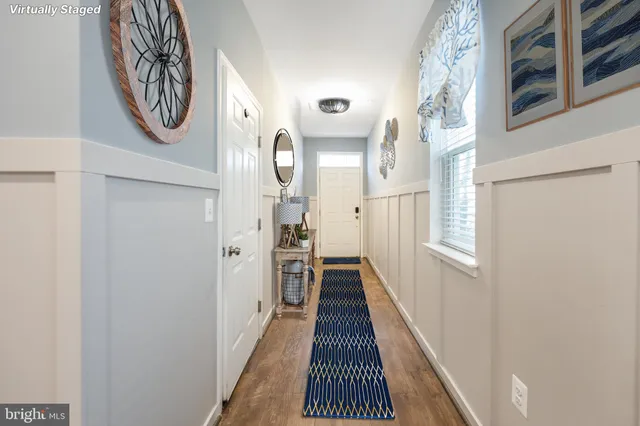 a view of a hallway with washer and dryer