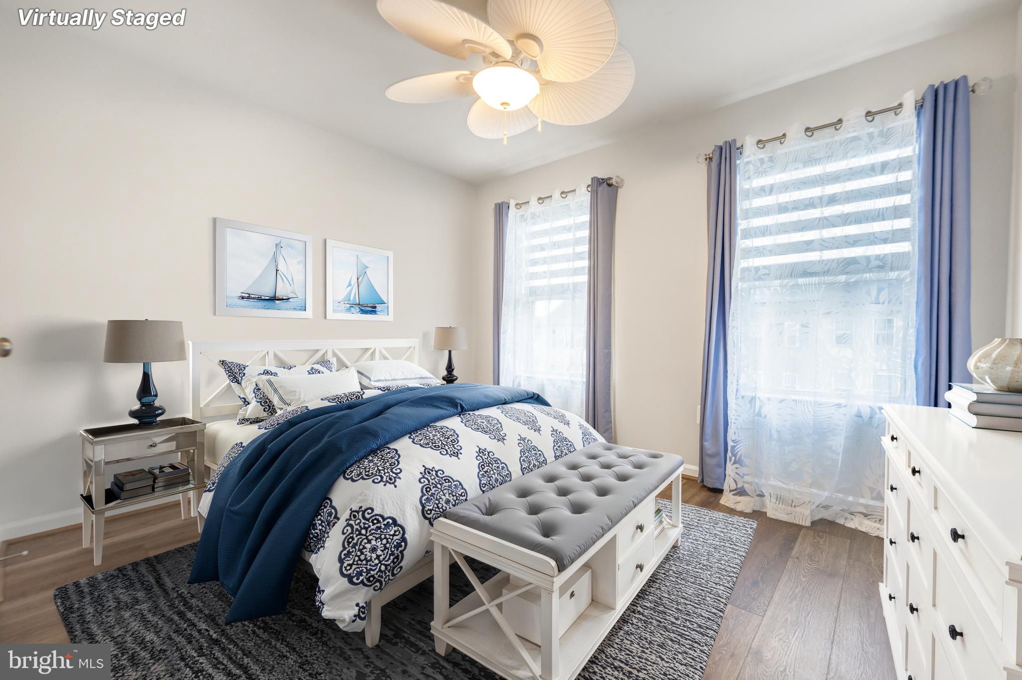 3510 Landing Way Silver Spring, MD 20906 - Photo 33 of 47 a bedroom with a bed and a chandelier