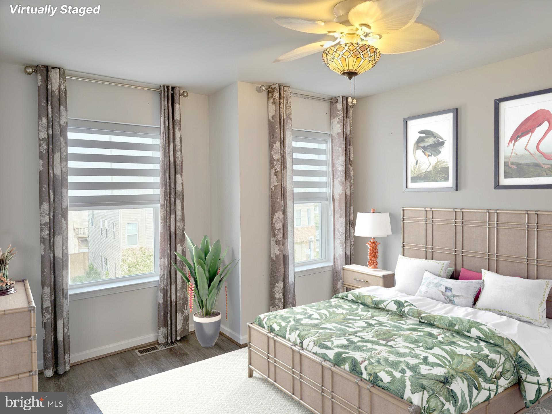 3510 Landing Way Silver Spring, MD 20906 - Photo 35 of 47 a bedroom with a bed and a chandelier