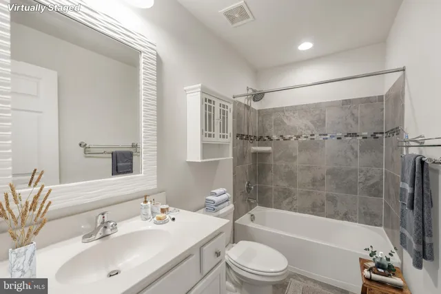 a view of a chair and table in backyard