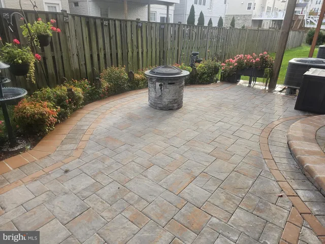 a view of a balcony with wooden floor and fence